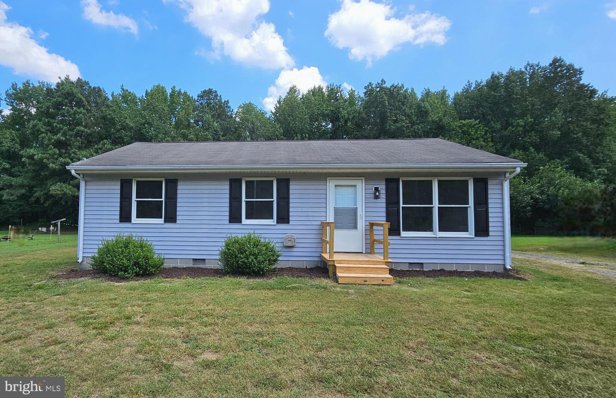 11285 Snethen Church Road Mardela Springs, MD 21837 - Photo 1 of 21 a front view of a house with a garden