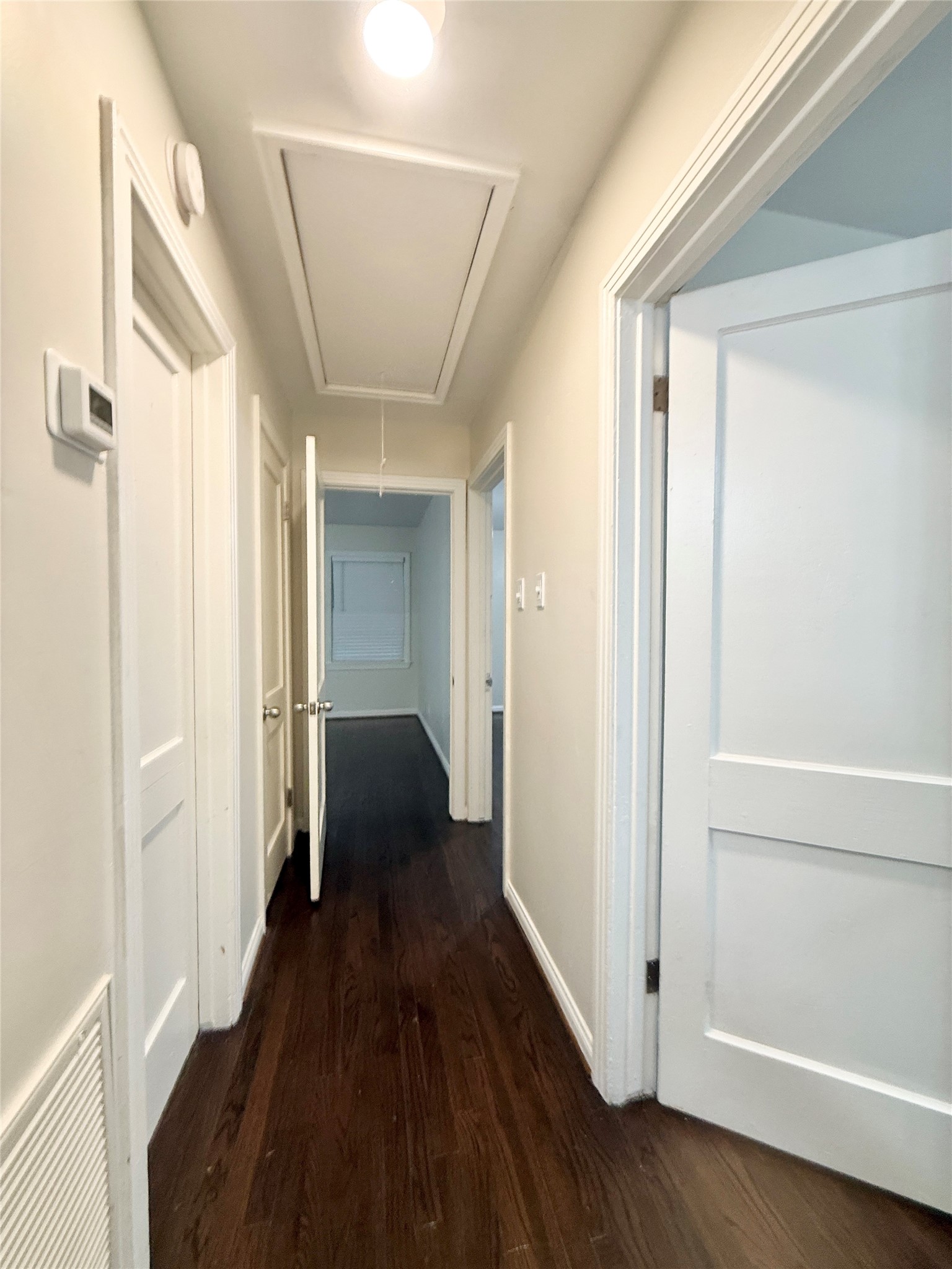 1232 San Felipe Street Angleton, TX 77515 - Photo 14 of 16 a view of a hallway with wooden floor