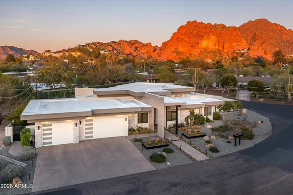 an aerial view of a house with swimming pool
