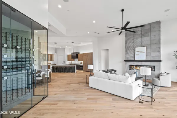 a kitchen with a table chairs refrigerator and microwave