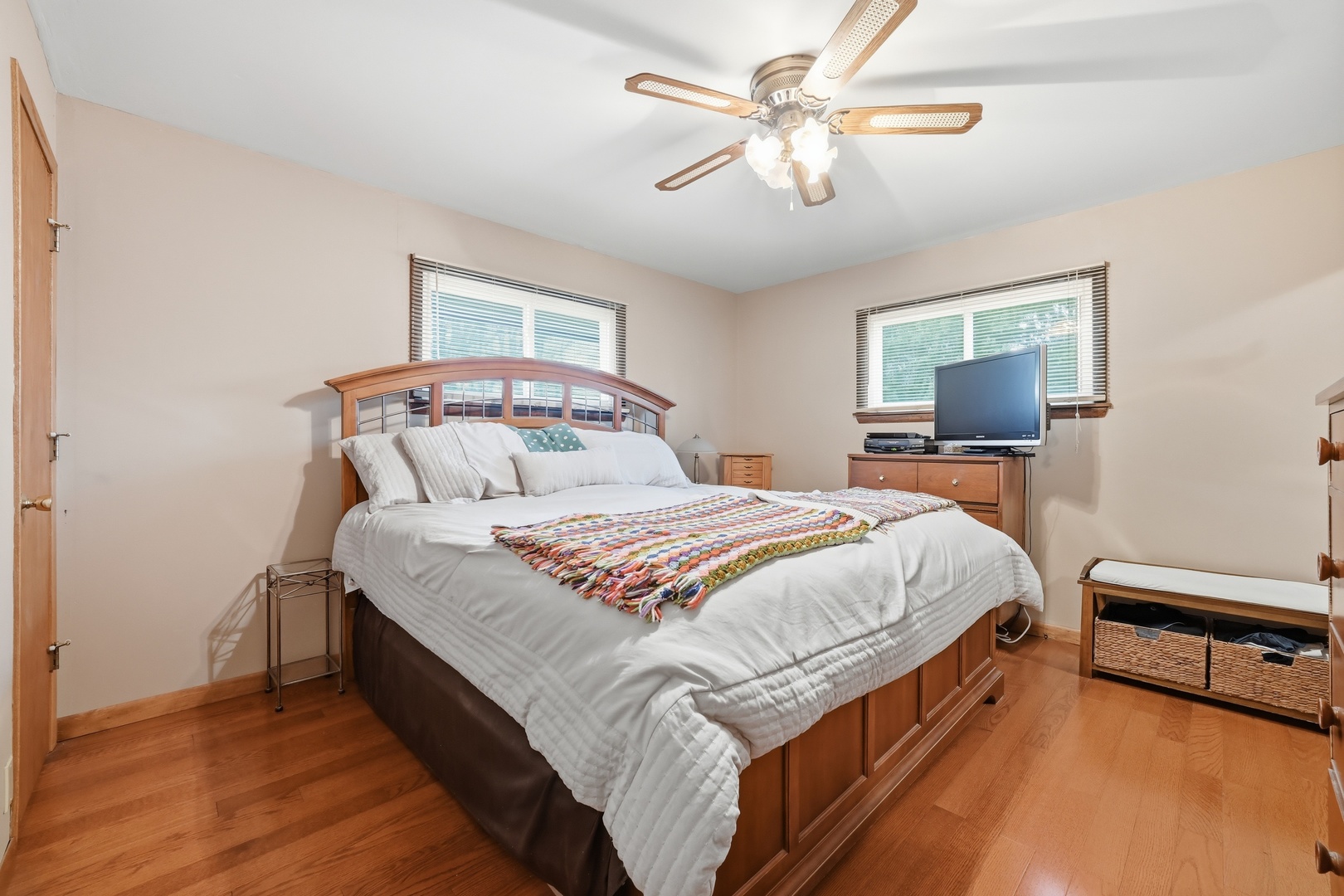 28007 Brickville Road Sycamore, IL 60178 - Photo 11 of 39 a bedroom with a bed a chandelier and a couch