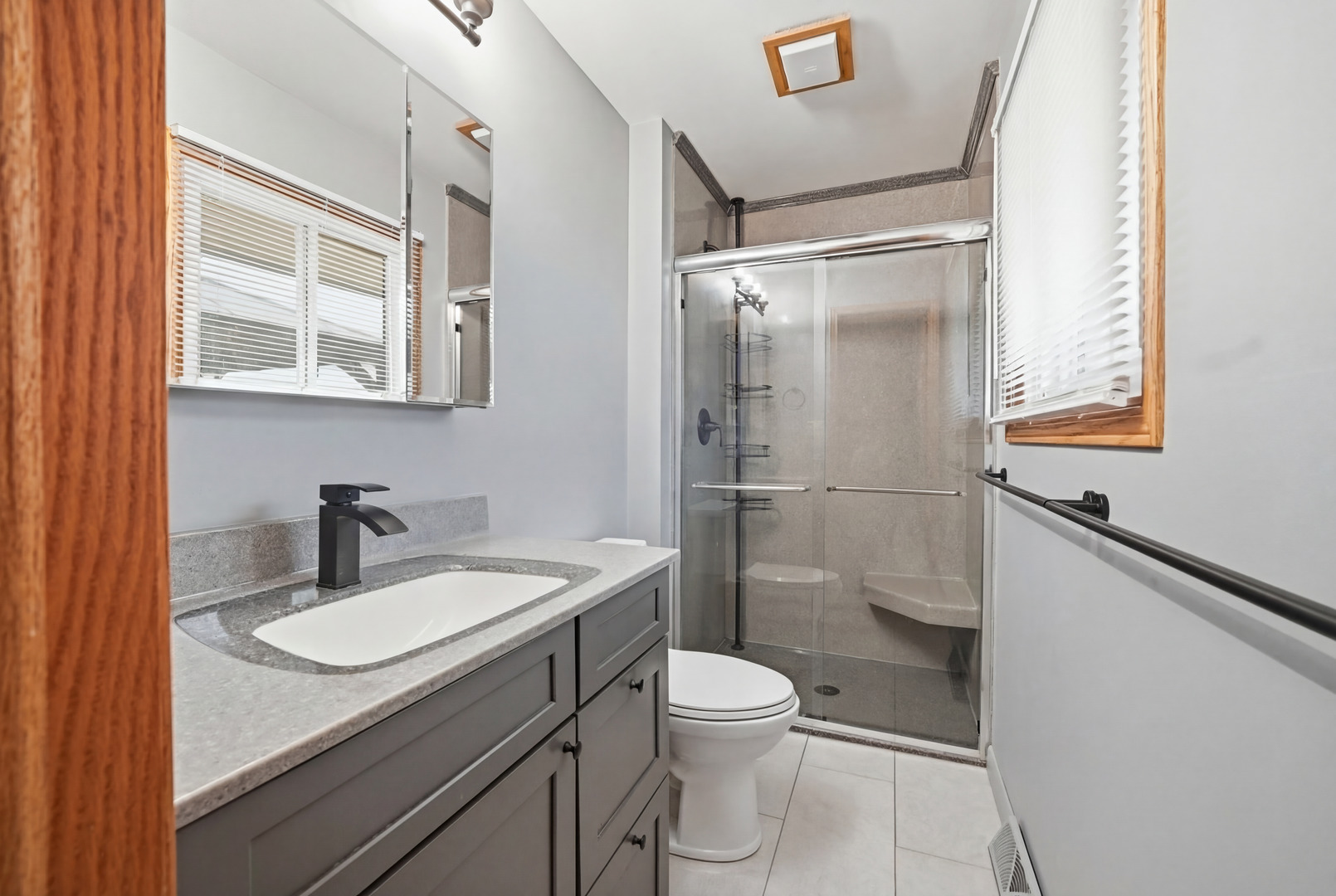 28007 Brickville Road Sycamore, IL 60178 - Photo 14 of 39 a bathroom with a sink toilet a mirror and shower