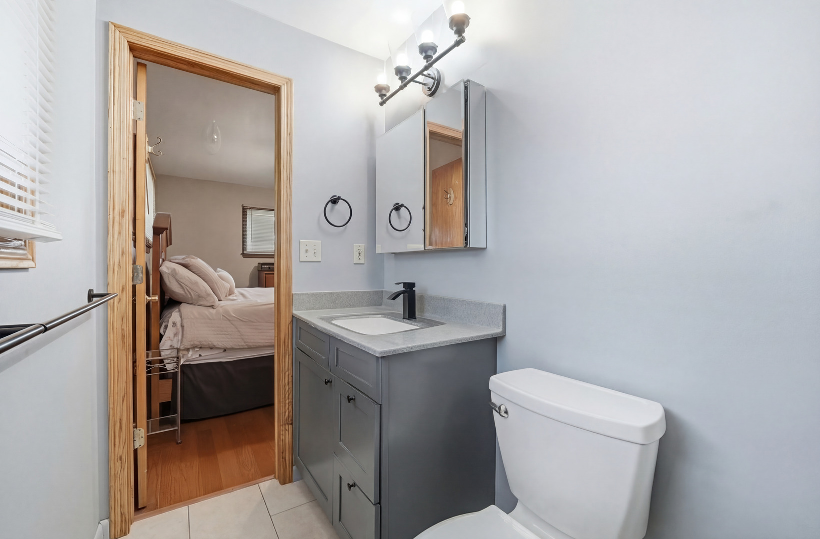 28007 Brickville Road Sycamore, IL 60178 - Photo 15 of 39 a en suite bathroom with a toilet sink and mirror