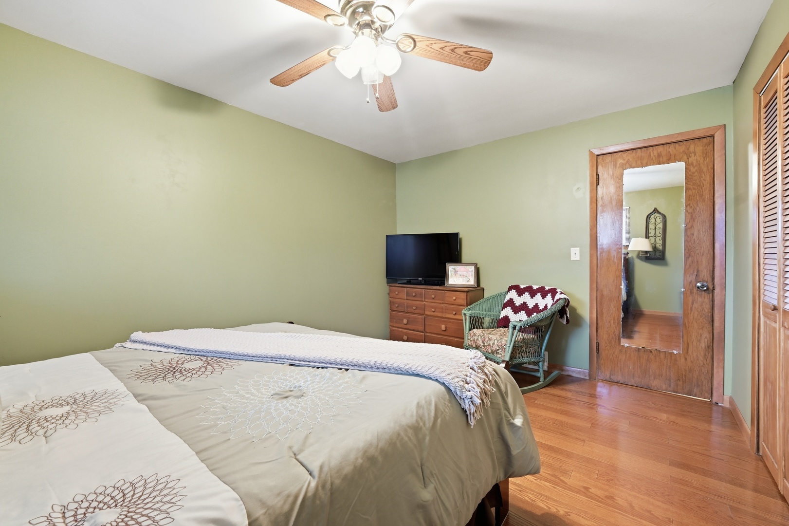 28007 Brickville Road Sycamore, IL 60178 - Photo 16 of 39 a bedroom with a bed and a chandelier