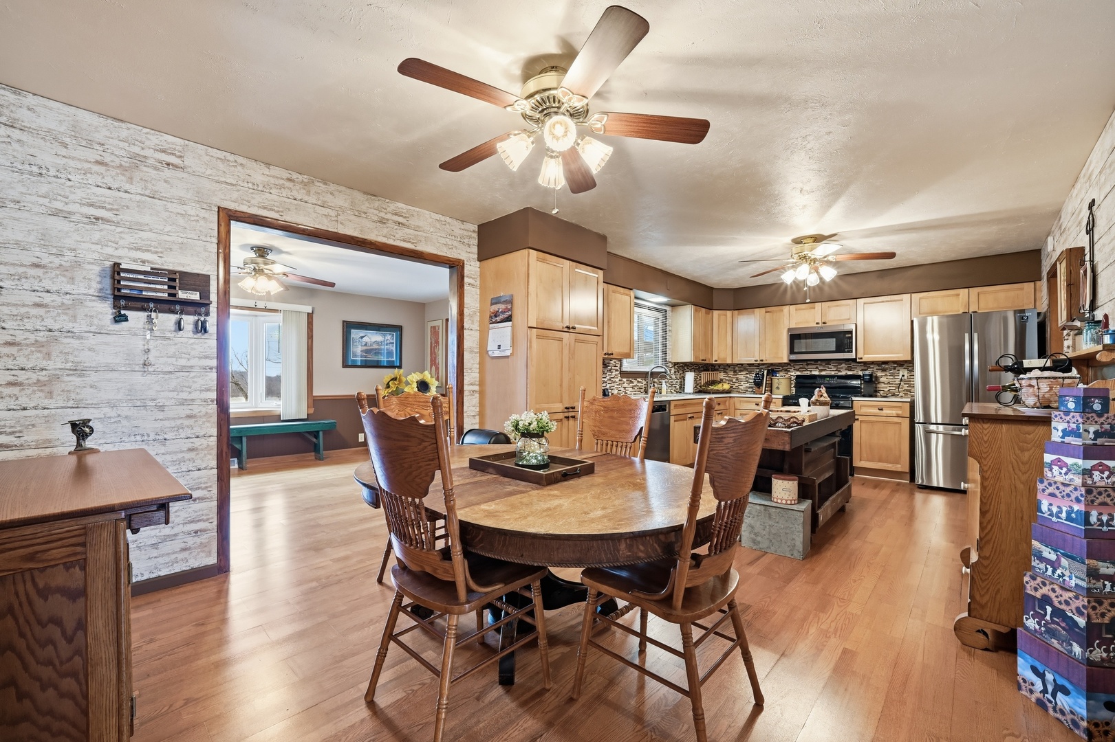 28007 Brickville Road Sycamore, IL 60178 - Photo 3 of 39 a view of a dining room with furniture and wooden floor