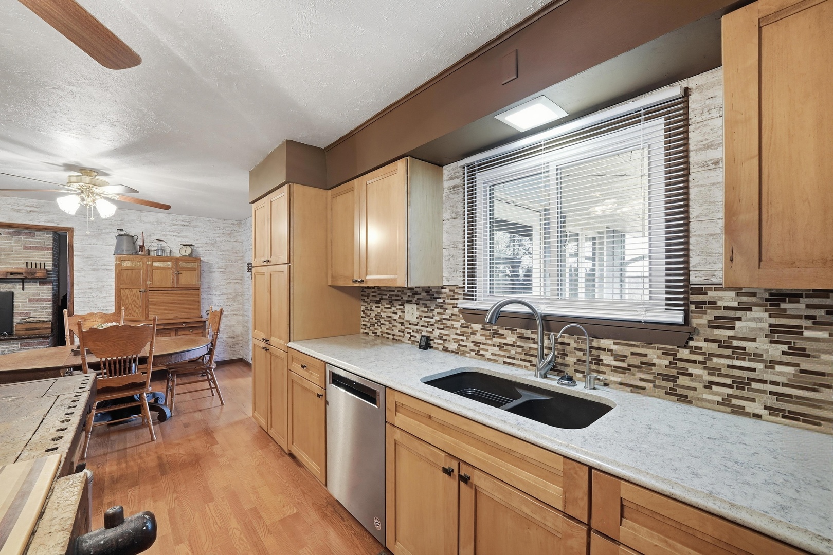 28007 Brickville Road Sycamore, IL 60178 - Photo 6 of 39 a kitchen with a sink and chairs