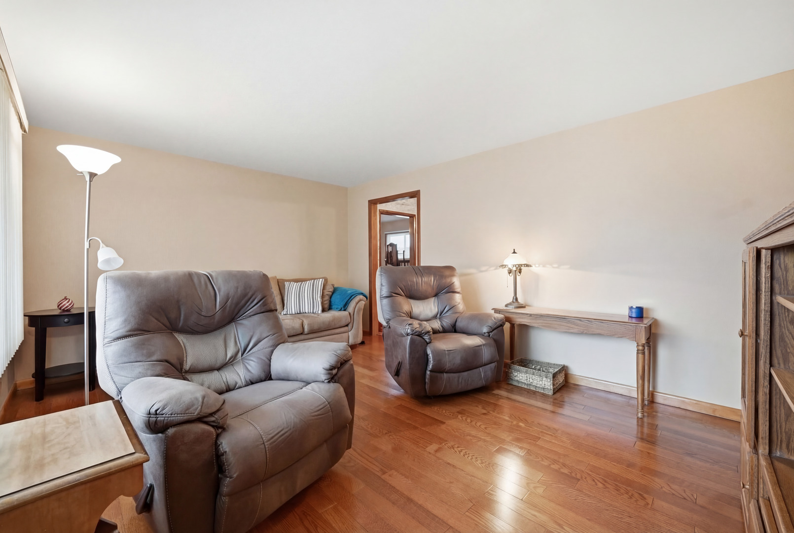 28007 Brickville Road Sycamore, IL 60178 - Photo 9 of 39 a living room with furniture and a wooden floor