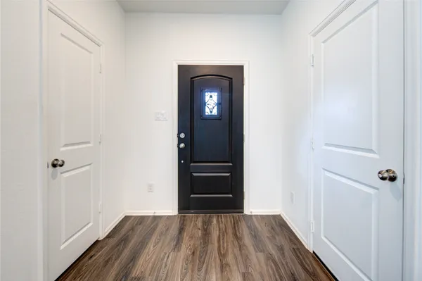 a view of a small space with wooden floor