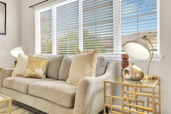 a living room with a couch and a large window