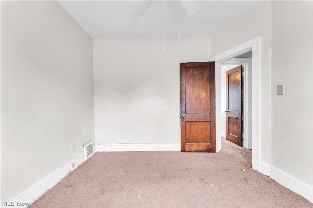 3713 Menlo Road Cleveland, OH 44120 - Photo 22 of 26 Carpeted spare room featuring ceiling fan