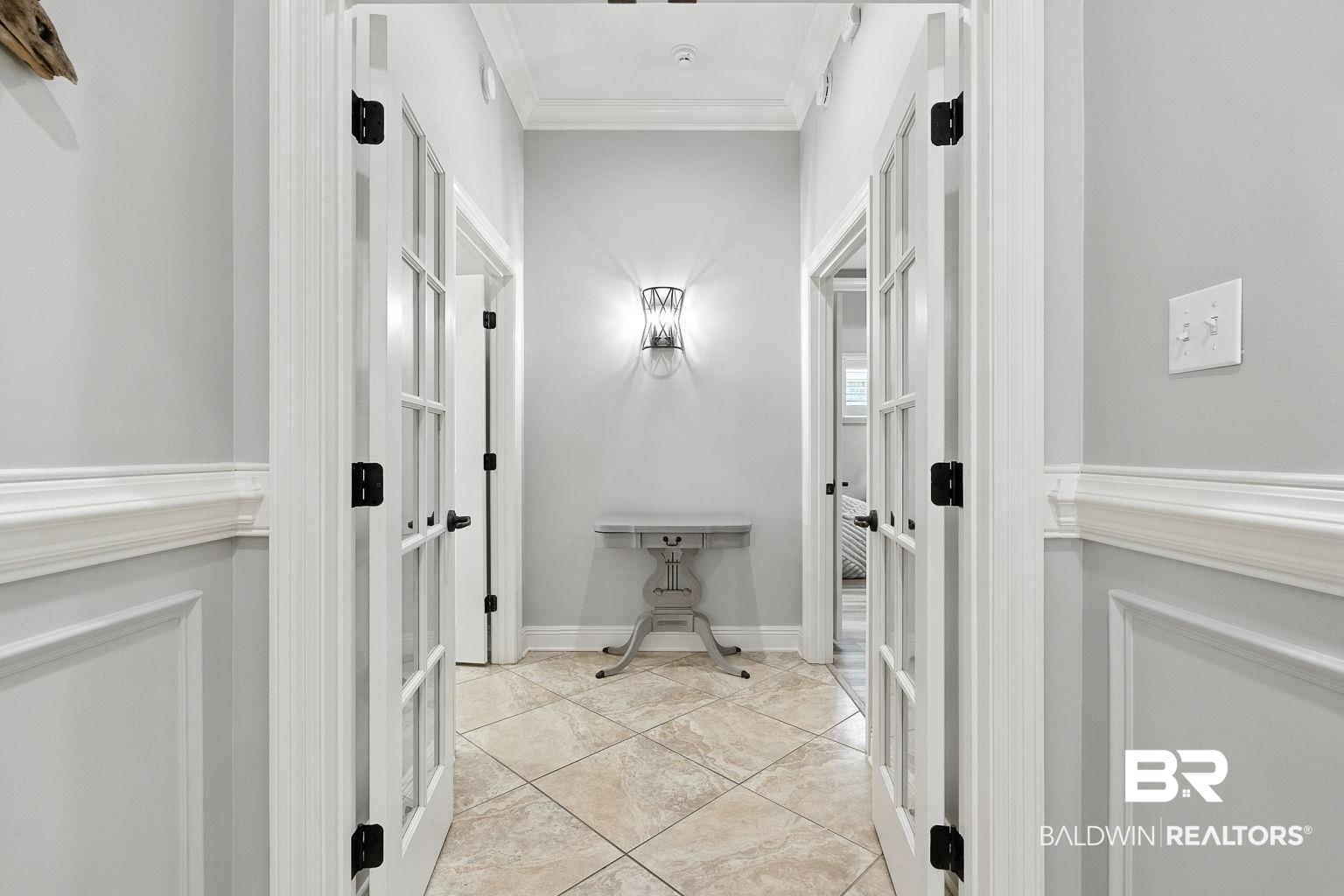 23357 Carnoustie Drive Foley, AL 36535 - Photo 44 of 99 Hallway with ornamental molding and light tile patterned floors