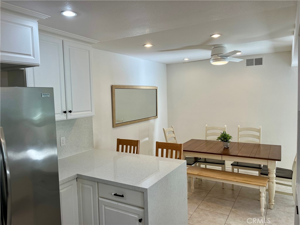 34134 Selva Road, Unit 248 Dana Point, CA 92629 - Photo 15 of 41 a kitchen with a sink and a refrigerator