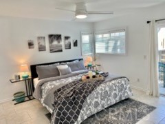 34134 Selva Road, Unit 248 Dana Point, CA 92629 - Photo 18 of 41 a bedroom with a bed and wooden floor