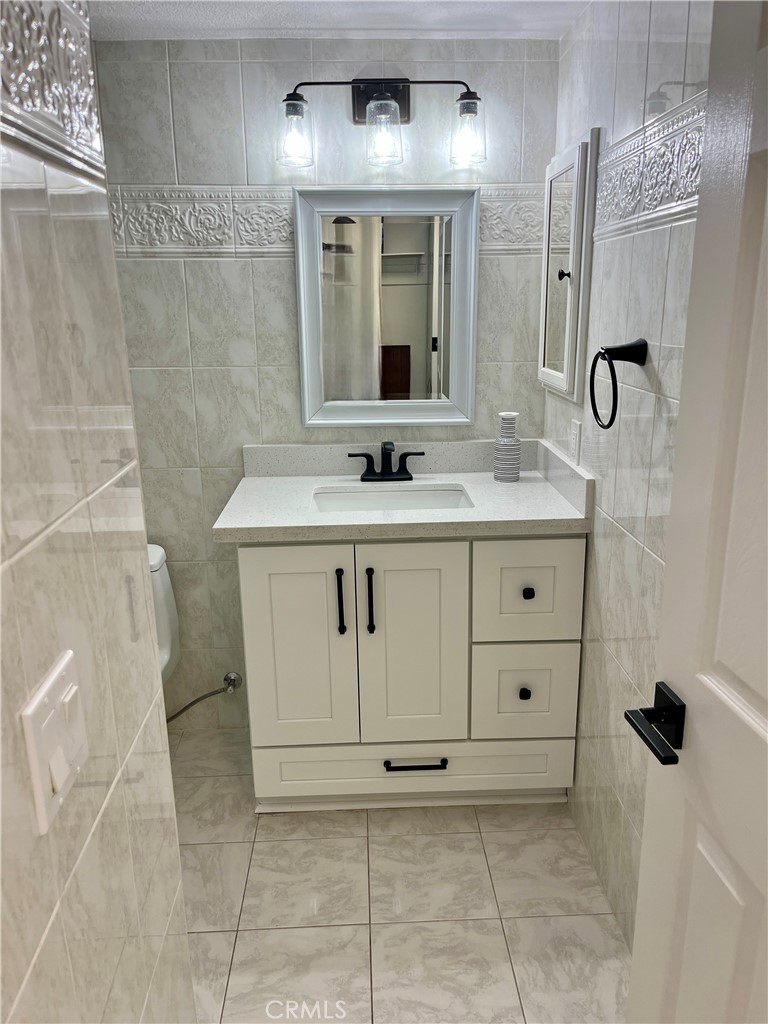 34134 Selva Road, Unit 248 Dana Point, CA 92629 - Photo 21 of 41 a bathroom with a sink a toilet and shower