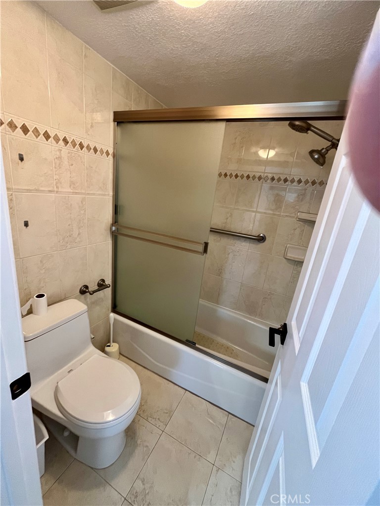 34134 Selva Road, Unit 248 Dana Point, CA 92629 - Photo 25 of 41 a bathroom with a toilet and a shower