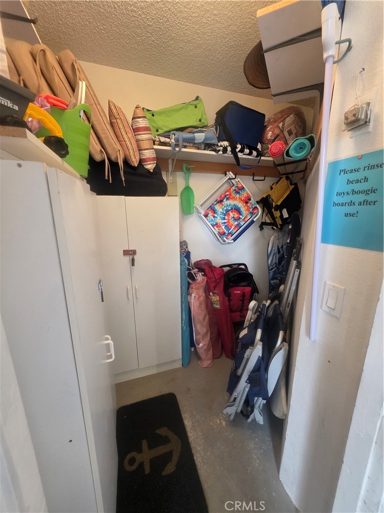 34134 Selva Road, Unit 248 Dana Point, CA 92629 - Photo 26 of 41 a view of walk in closet with clothes and shoes