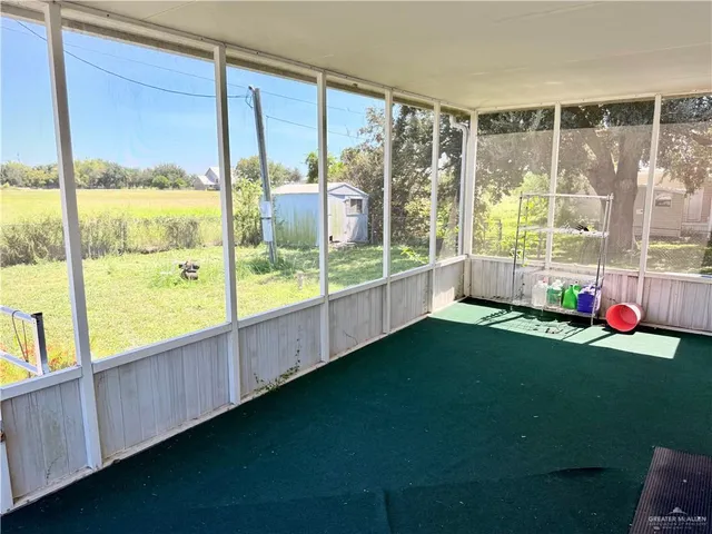 a view of an empty room with a large window