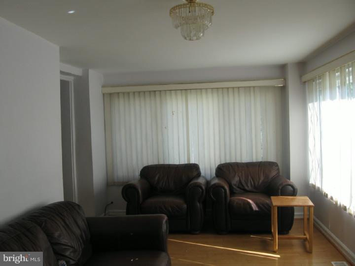 7007 Hilltop Road Upper Darby, PA 19082 - Photo 2 of 20 a living room with furniture and a window