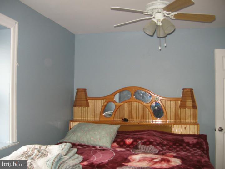 7007 Hilltop Road Upper Darby, PA 19082 - Photo 11 of 20 a bedroom with a bed and dresser