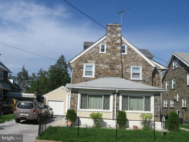 7007 Hilltop Road Upper Darby, PA 19082 - Photo 19 of 20 a view of a white house next to a yard
