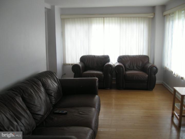 7007 Hilltop Road Upper Darby, PA 19082 - Photo 3 of 20 a living room with furniture and a window