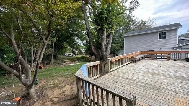 a view of wooden floor and windows in a room