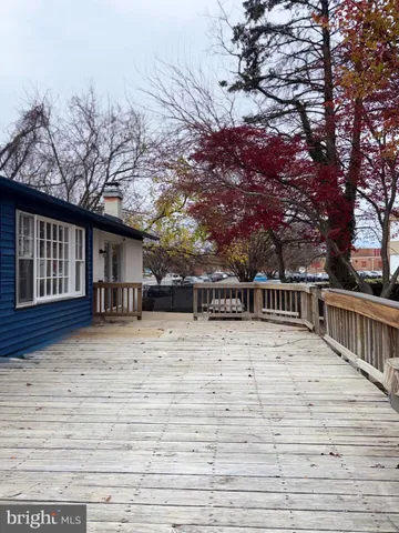 a view of an empty room and wooden floor