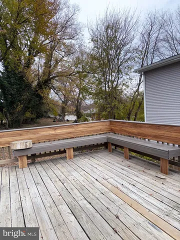 a kitchen with granite countertop a refrigerator and a sink