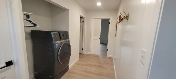 a view of a storage & utility room with washer and dryer
