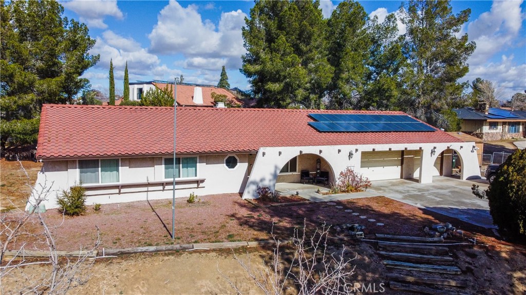 19140 Tomahawk Road Apple Valley, CA 92307 - Photo 1 of 1 a view of a house with backyard and sitting area
