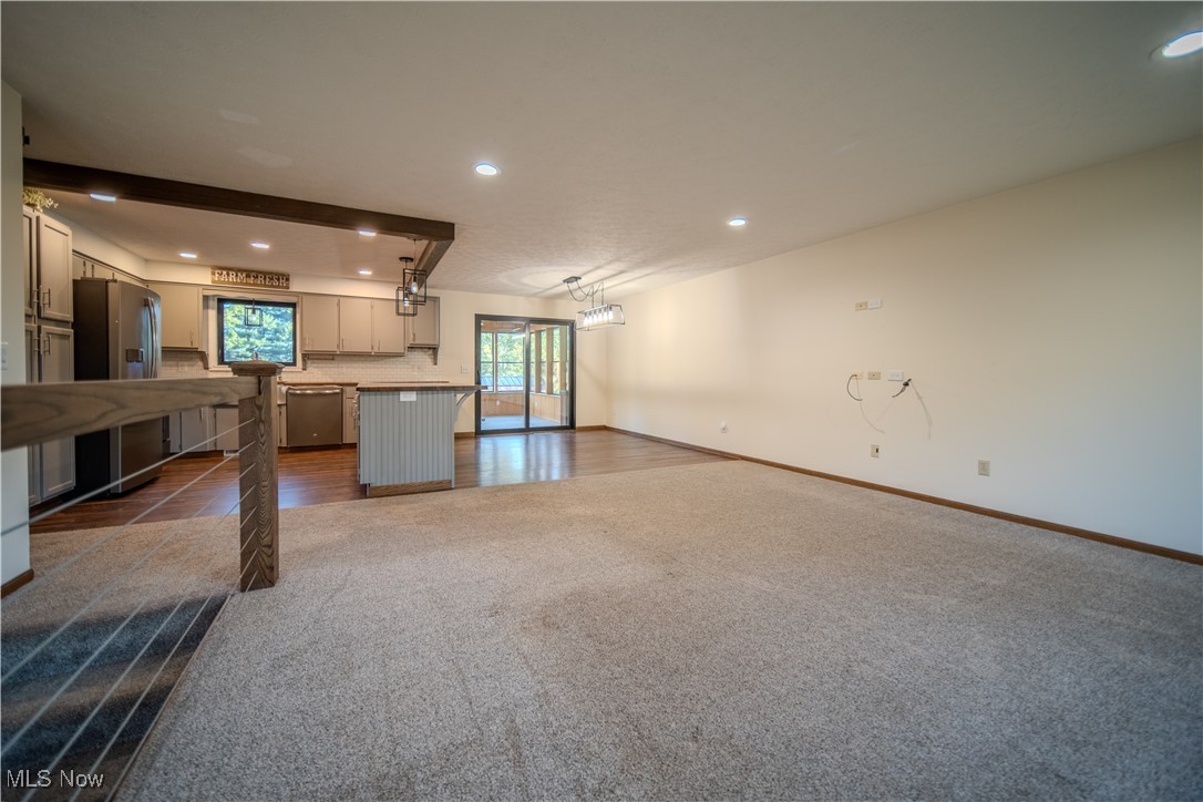 3459 Laubert Road Atwater, OH 44201 - Photo 8 of 39 Unfurnished living room featuring recessed lighting, dark carpet, and dark wood finished floors