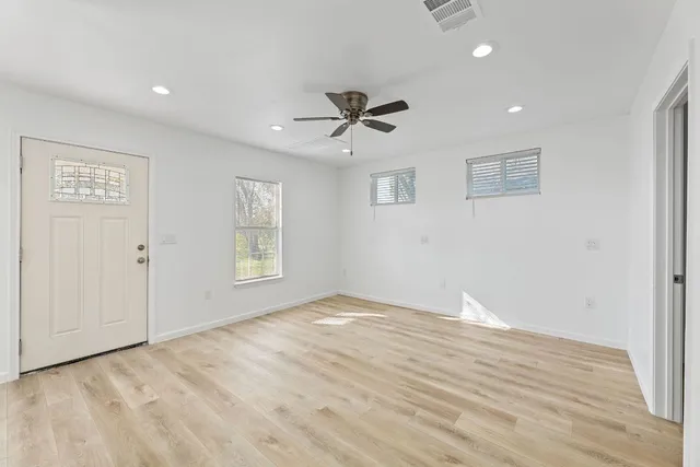 a view of an empty room with a window