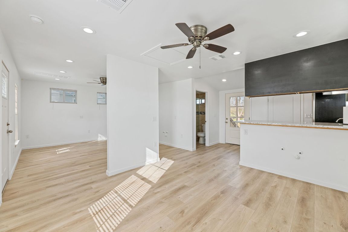 603 East 3rd Street Taylor, TX 76574 - Photo 15 of 30 a view of a livingroom with a ceiling fan