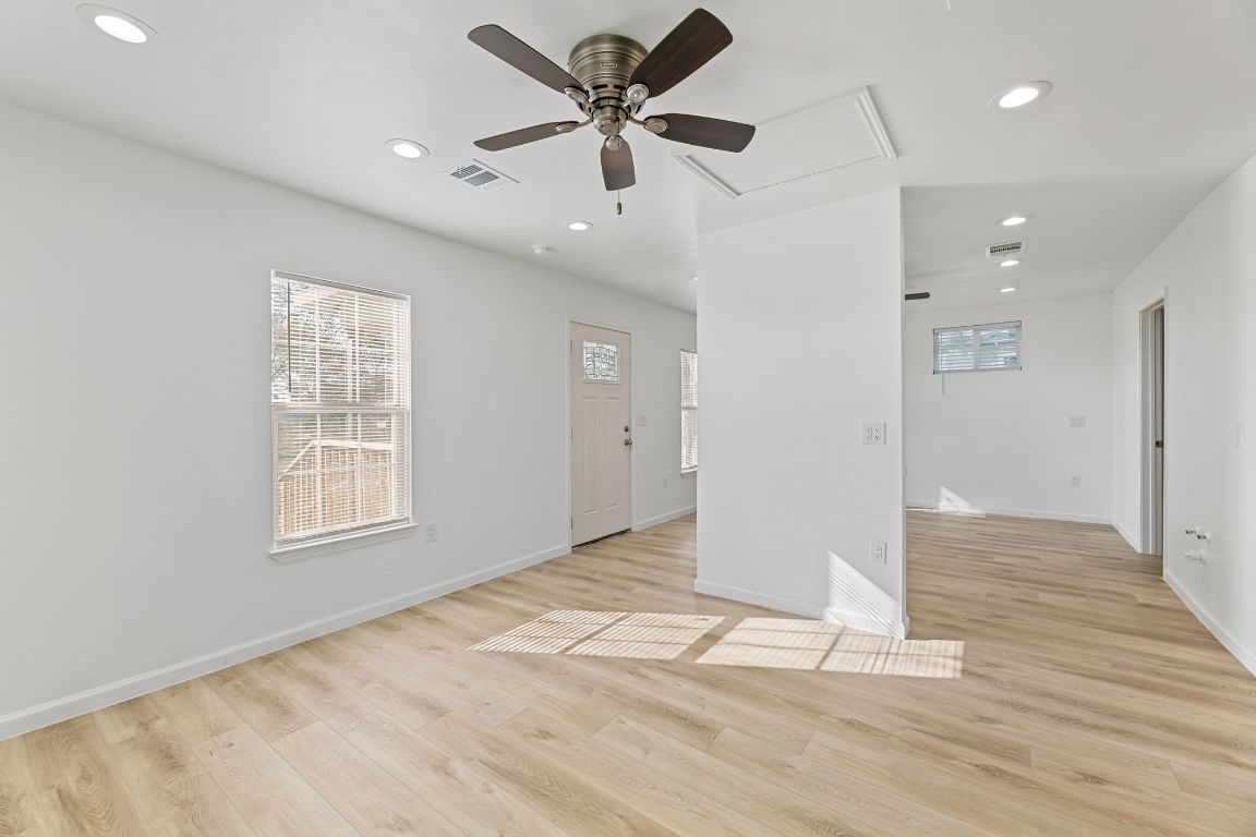 603 East 3rd Street Taylor, TX 76574 - Photo 16 of 30 a view of an empty room with window and wooden floor