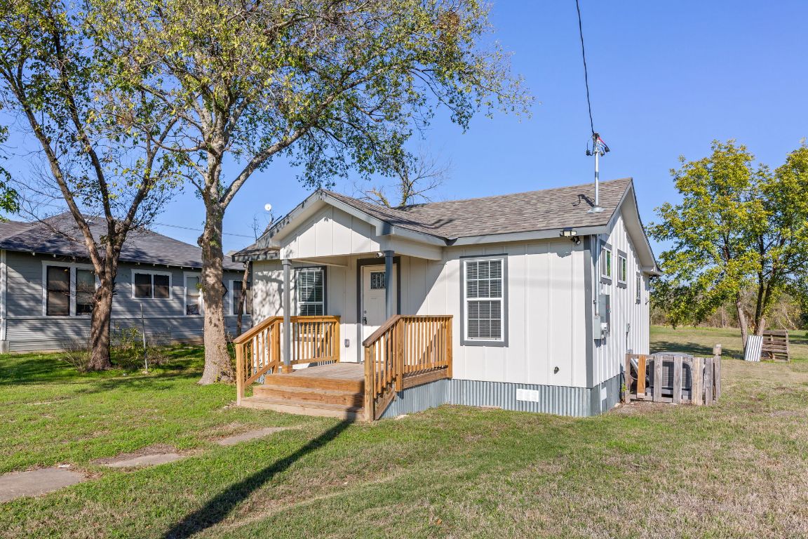 603 East 3rd Street Taylor, TX 76574 - Photo 2 of 30 a view of a house with a yard