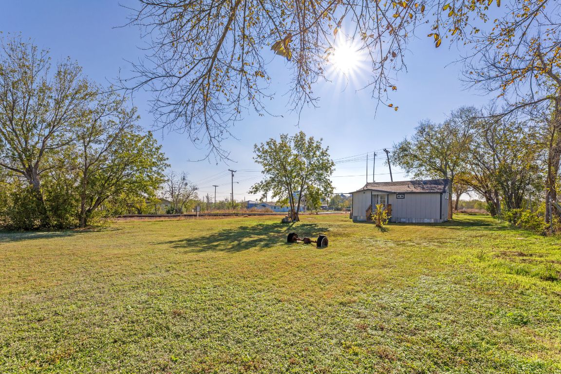 603 East 3rd Street Taylor, TX 76574 - Photo 28 of 30 a view of a swimming pool and an outdoor space
