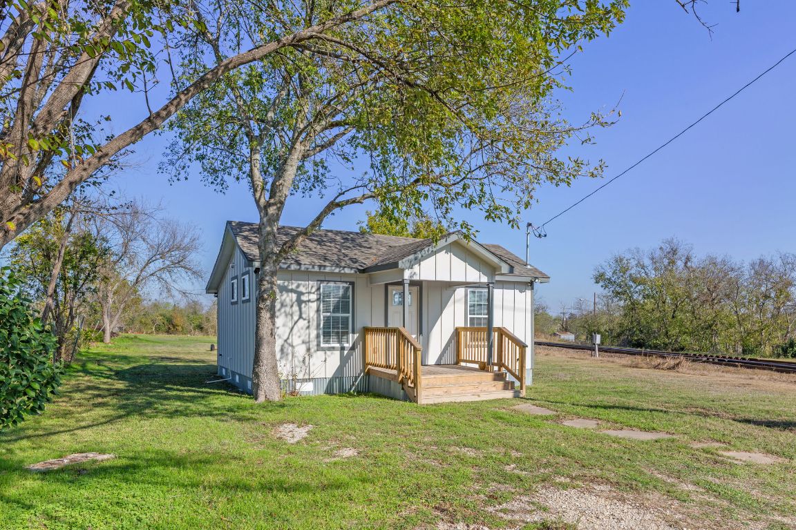 603 East 3rd Street Taylor, TX 76574 - Photo 4 of 30 a view of a house with a yard