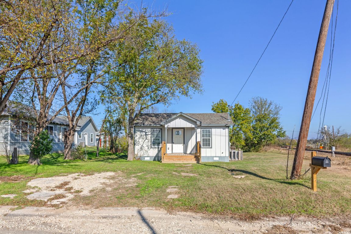 603 East 3rd Street Taylor, TX 76574 - Photo 5 of 30 a view of a house with a yard