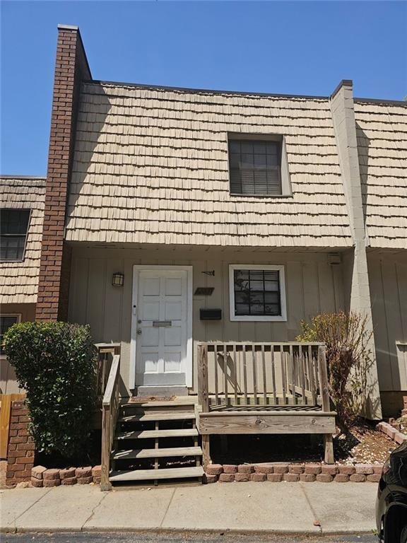 6433 Stone Way Morrow, GA 30260 - Photo 1 of 8 a view of a house with wooden deck