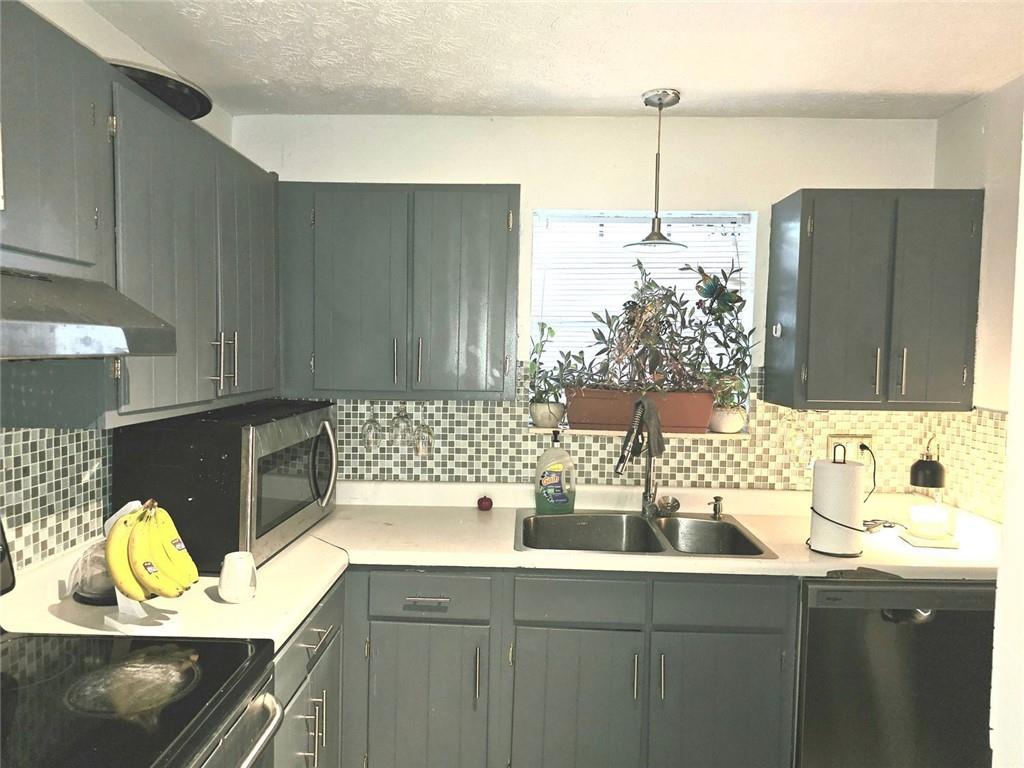 6433 Stone Way Morrow, GA 30260 - Photo 4 of 8 a kitchen with a sink and a cabinets