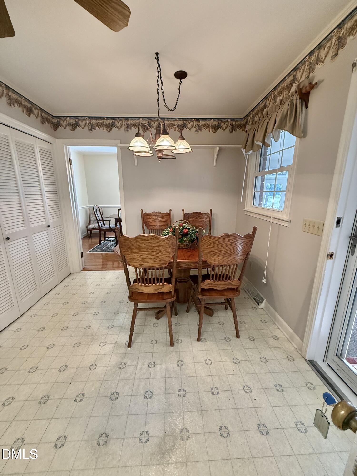 424 Tanglewood Circle Roxboro, NC 27573 - Photo 18 of 47 a dining room with furniture and wooden floor