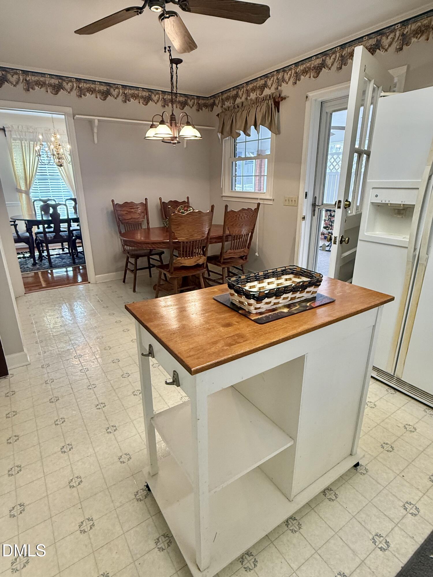 424 Tanglewood Circle Roxboro, NC 27573 - Photo 19 of 47 a kitchen with stainless steel appliances granite countertop a sink and a refrigerator