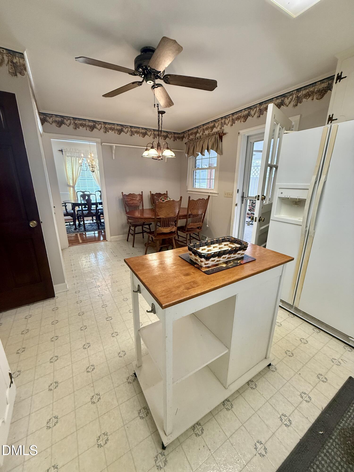 424 Tanglewood Circle Roxboro, NC 27573 - Photo 20 of 47 a view of kitchen with sink window and refrigerator