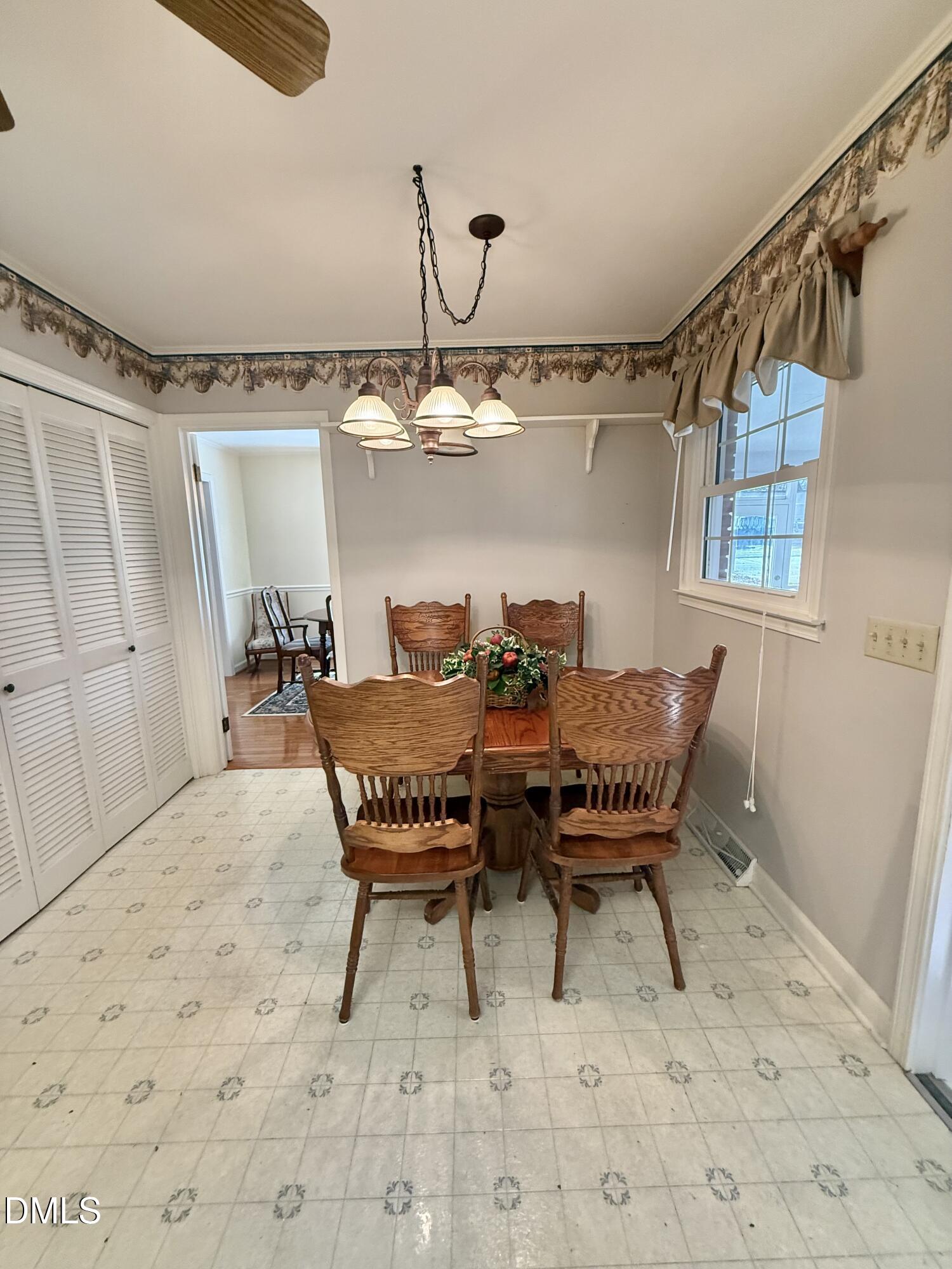 424 Tanglewood Circle Roxboro, NC 27573 - Photo 21 of 47 a view of a dining room with furniture
