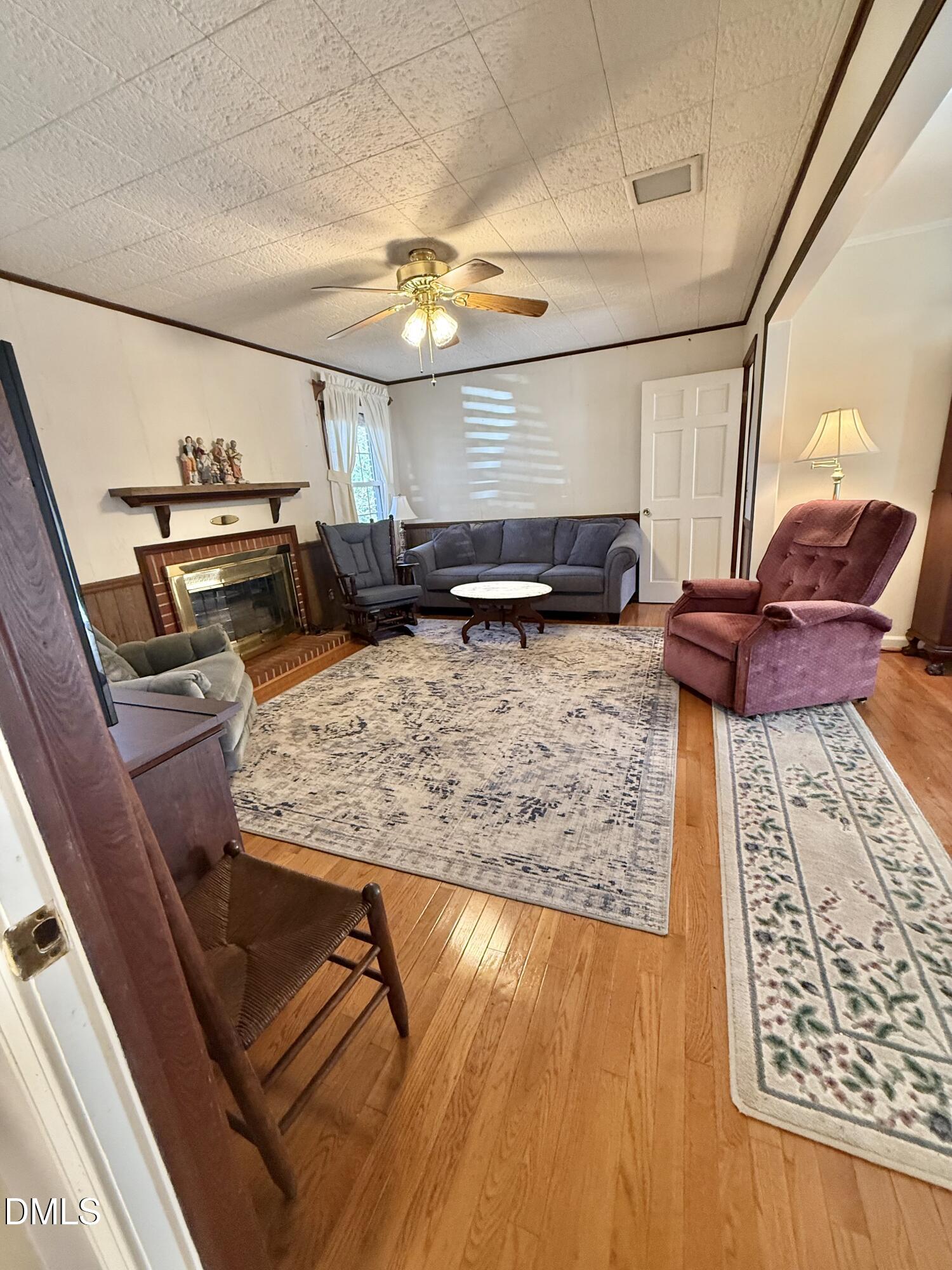 424 Tanglewood Circle Roxboro, NC 27573 - Photo 24 of 47 a living room with furniture and a rug