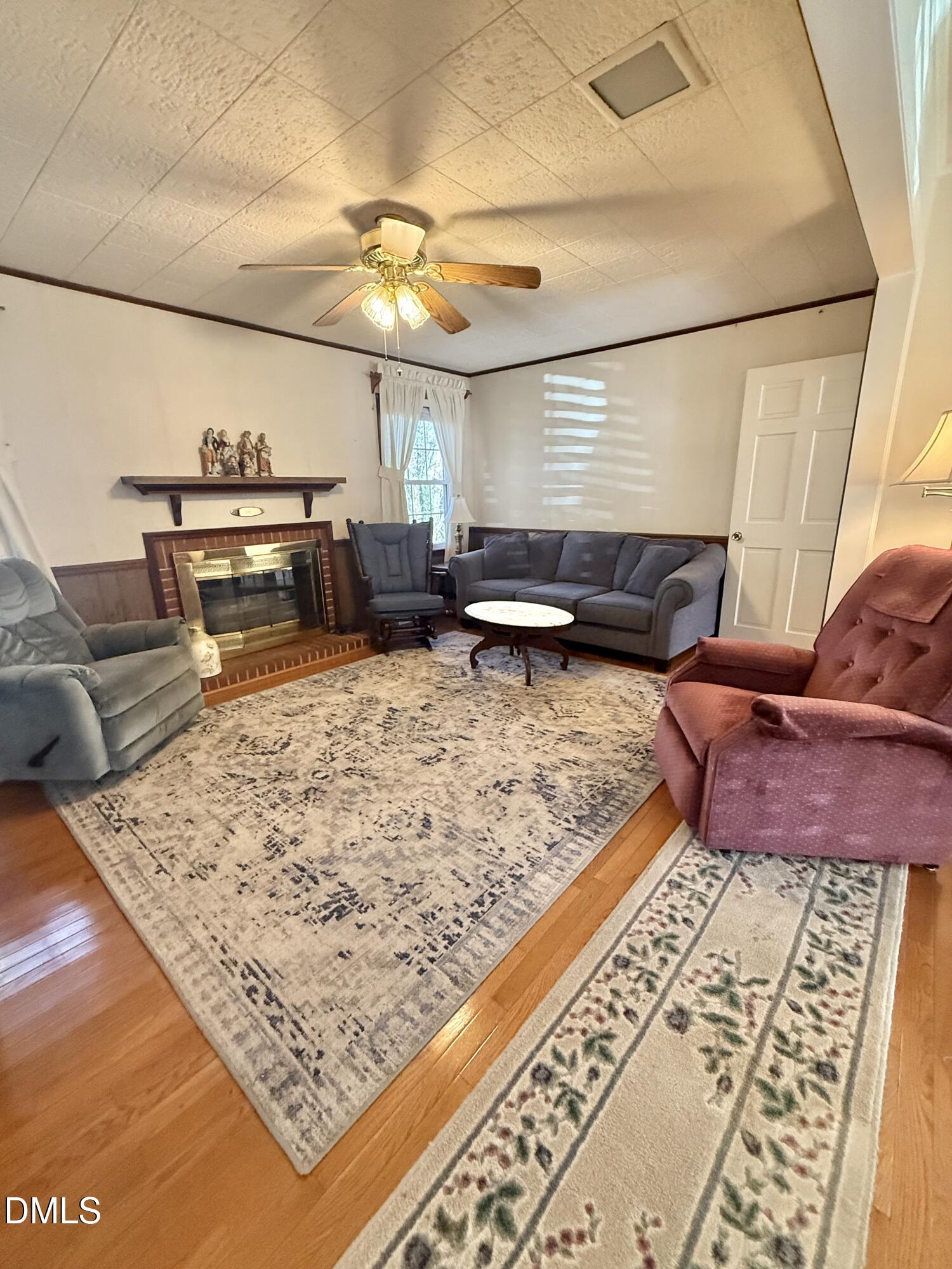 424 Tanglewood Circle Roxboro, NC 27573 - Photo 26 of 47 a living room with furniture and a rug