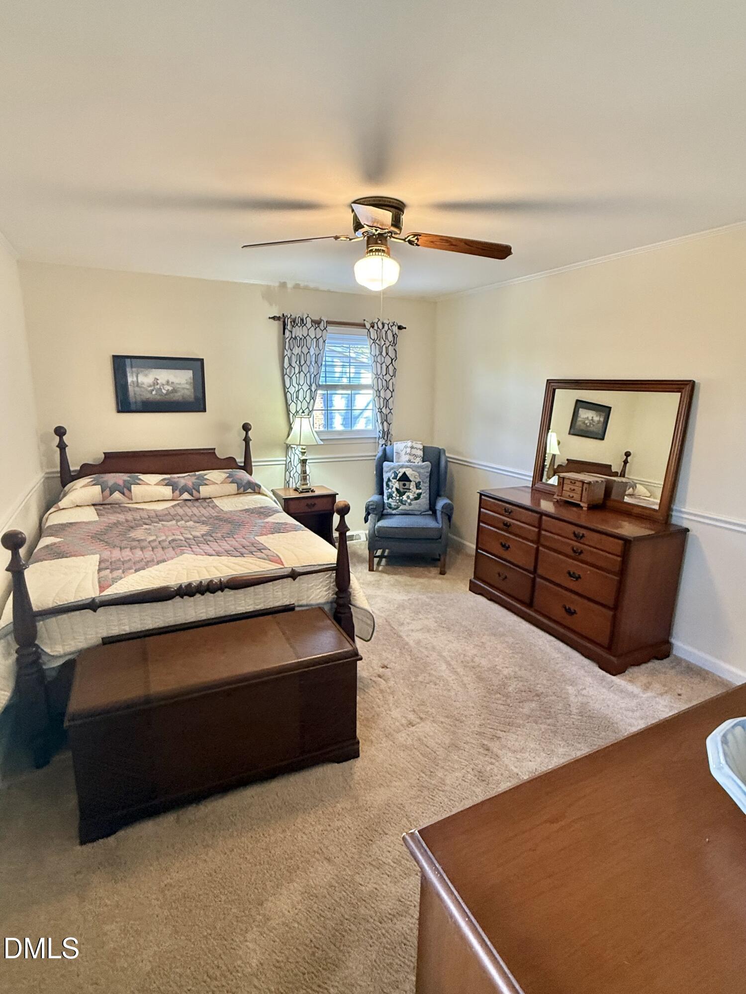 424 Tanglewood Circle Roxboro, NC 27573 - Photo 30 of 47 a bedroom with a bed dresser and a window