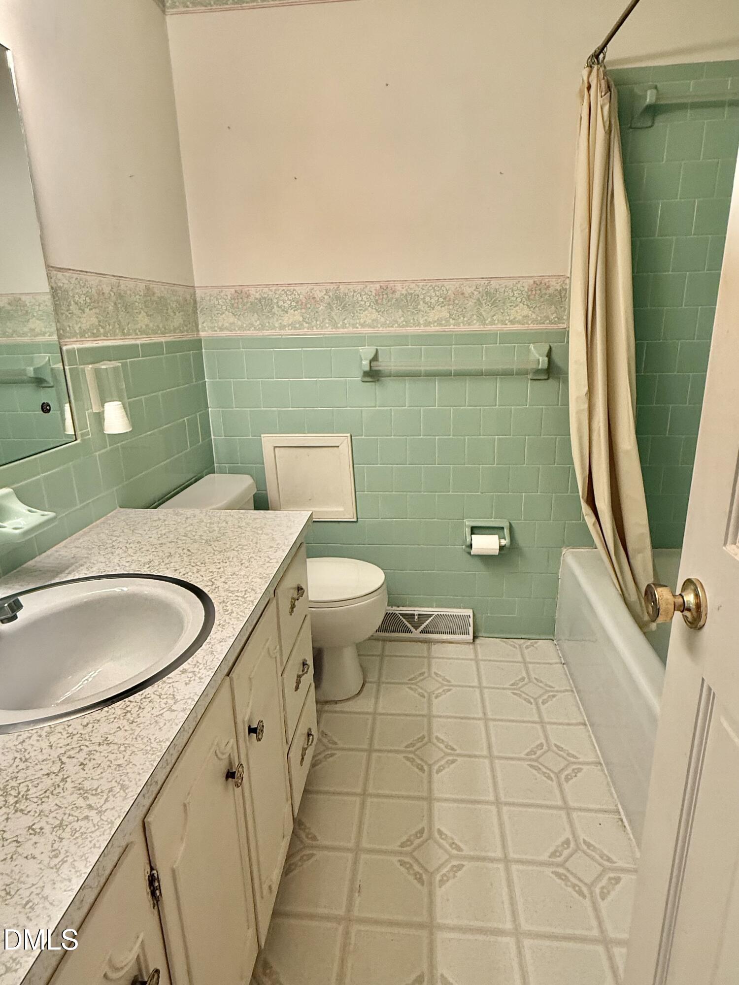 424 Tanglewood Circle Roxboro, NC 27573 - Photo 33 of 47 a bathroom with a granite countertop toilet sink and mirror