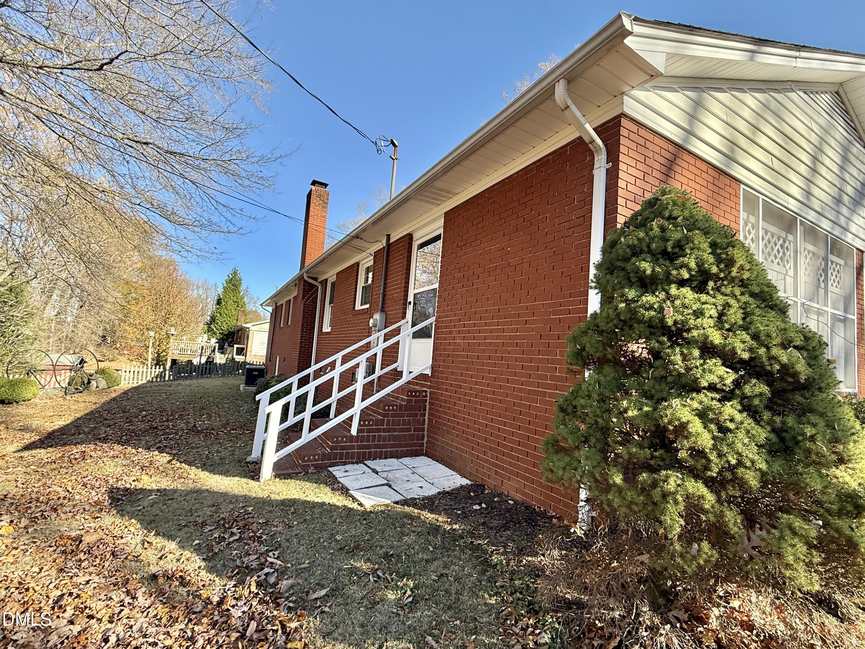 424 Tanglewood Circle Roxboro, NC 27573 - Photo 42 of 47 a view of a house with a yard