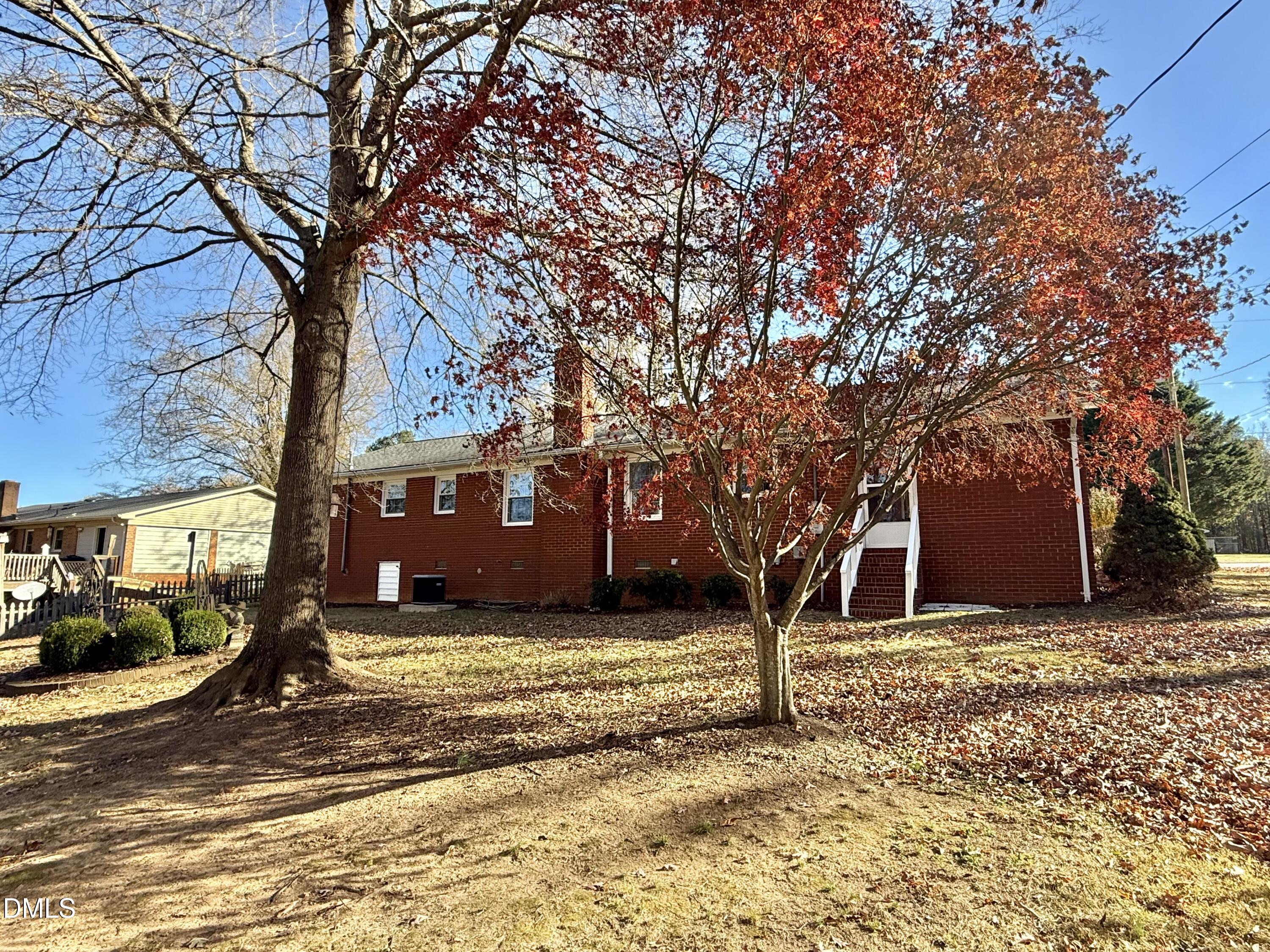 424 Tanglewood Circle Roxboro, NC 27573 - Photo 45 of 47 a view of a field with trees in front of it
